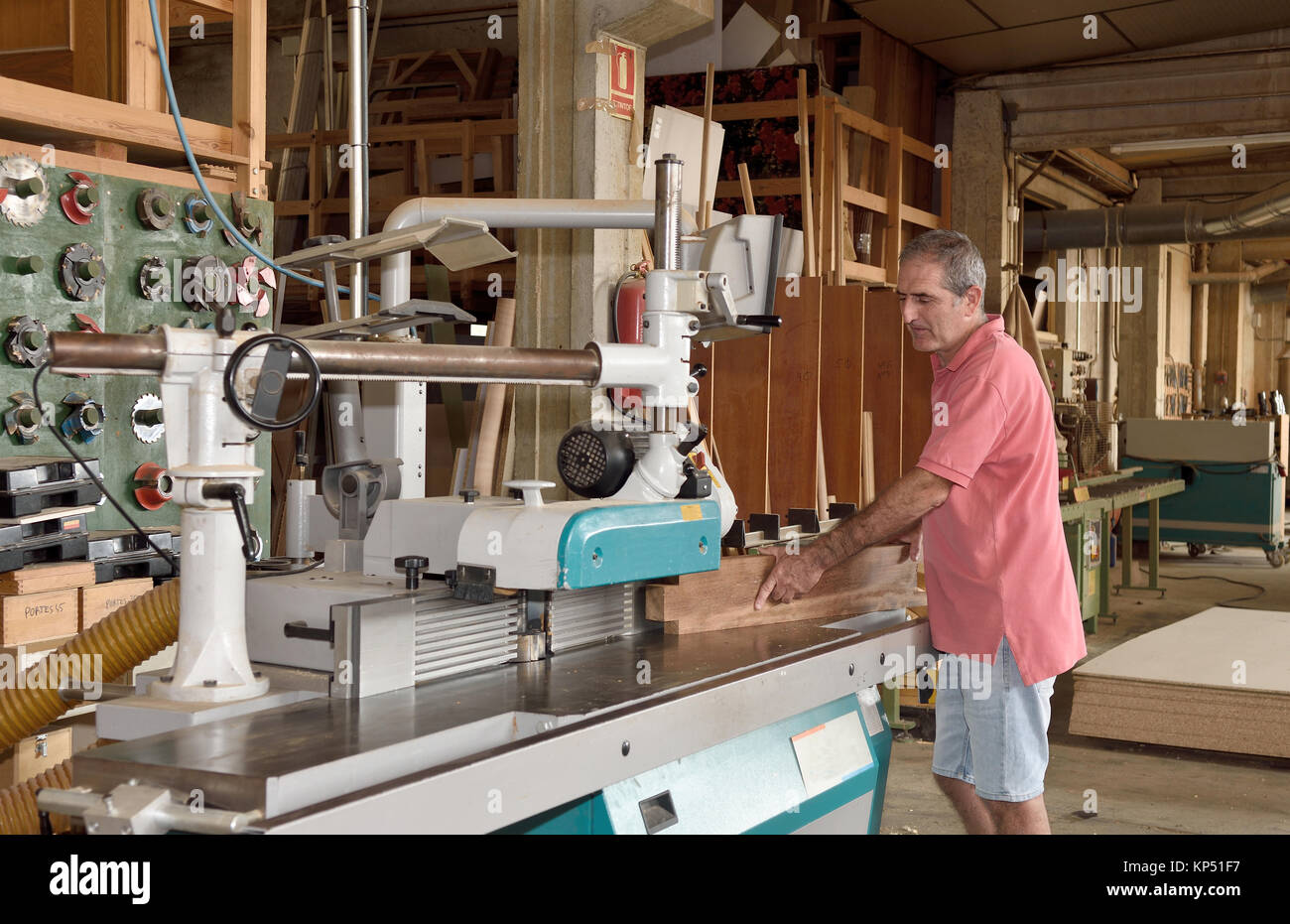 carpenter with the tupi machine in the carpentry Stock Photo - Alamy