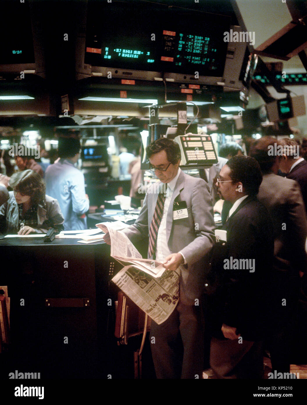 May 1982,New York,NYSE,Stock Exchange interior,trading floor,brokers reading newspaper,traders,Manhattan,New york City,NY,NYC,USA, Stock Photo