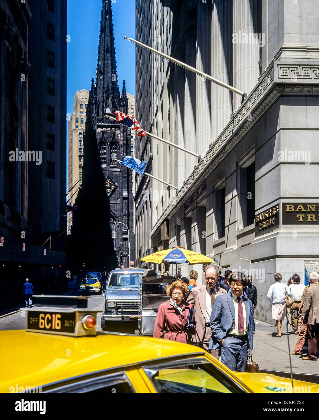 May 1982,New York,Wall street,yellow cab,Trinity church,financial district,lower Manhattan,New york City,NY,NYC,USA, Stock Photo