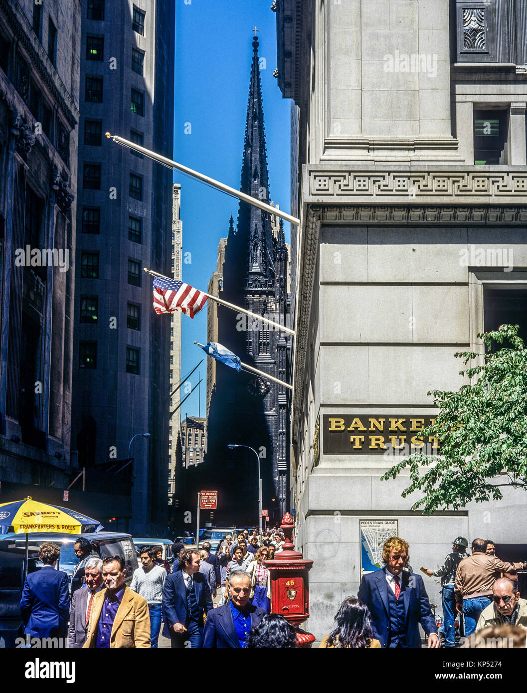 May 1982,New York,Wall street,people,Trinity church,financial district,lower Manhattan,New york City,NY,NYC,USA, Stock Photo
