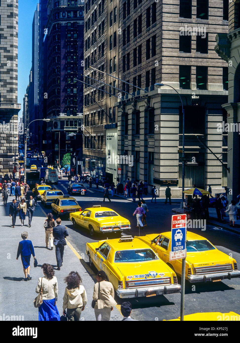 May 1982,New York,Wall street,yellow cabs,people,financial district,lower Manhattan,New york City,NY,NYC,USA, Stock Photo