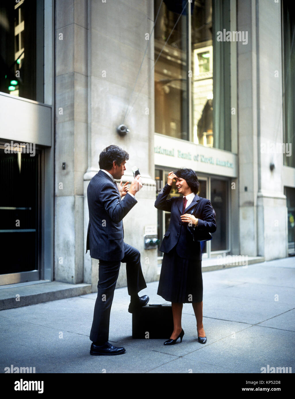 May 1982,New York,businessman and businesswoman chatting,Wall street,financial district,lower Manhattan,New york City,NY,NYC,USA, Stock Photo