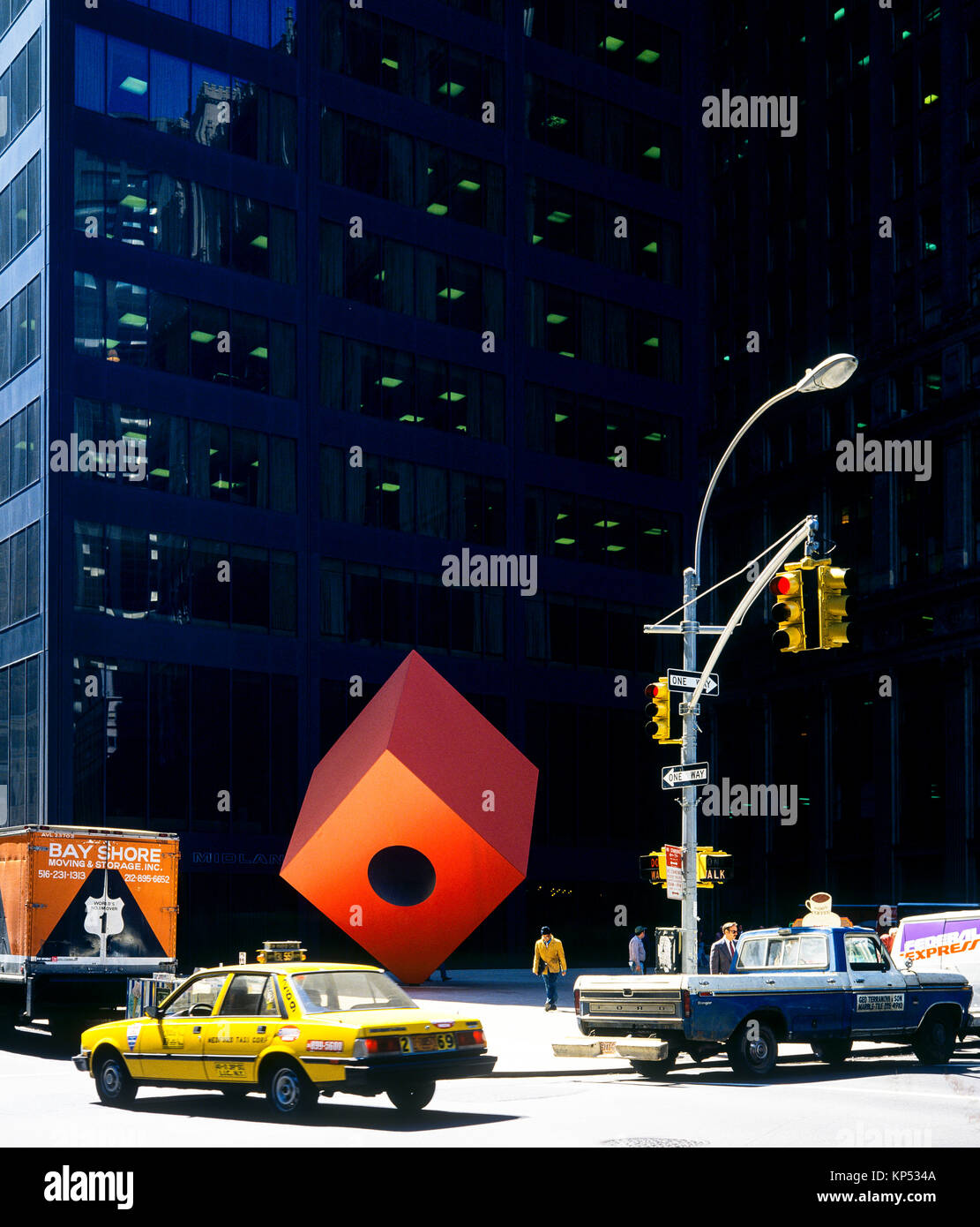 May 1982,New York,The Red Cube sculpture by Isamu Noguchi 1968,140 Broadway,financial district,lower Manhattan,New york City,NY,NYC,USA, Stock Photo