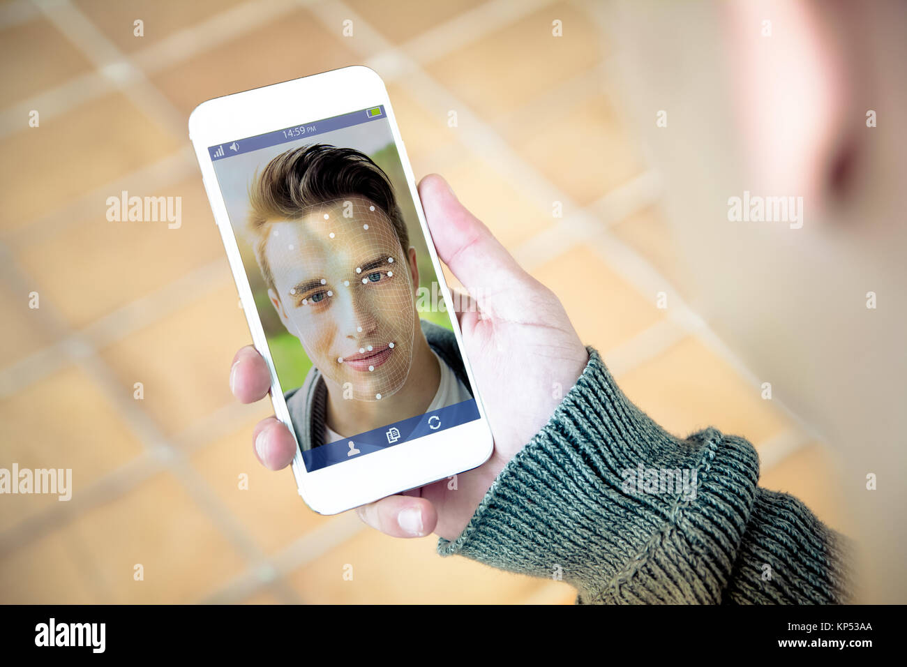 millennial using face id technology on smartphone Stock Photo