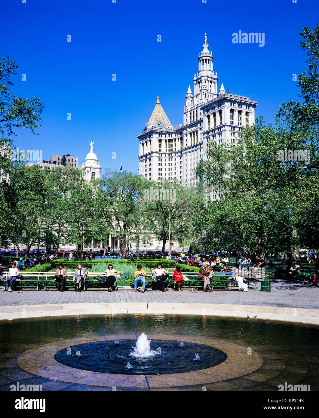 May 1982,New York,water fountain,City Hall park,people relaxing on benches,City Hall building,Manhattan,New york City,NY,NYC,USA, Stock Photo