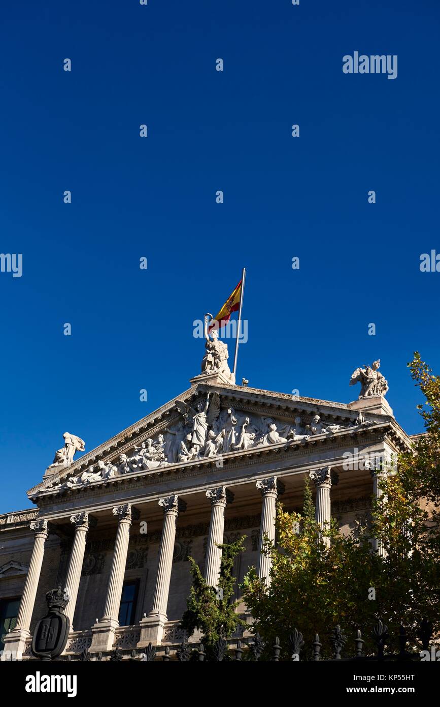 Spanish Flag on the Roof of the National Library, Paseo de Recoletos, Madrid, Spain. Europe, architecture and art. Stock Photo
