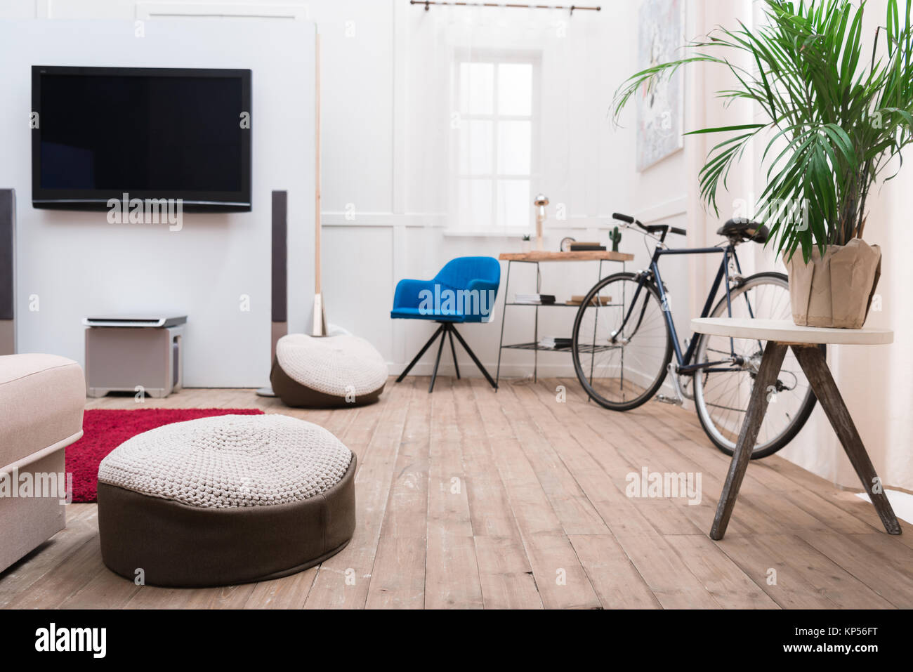 Interior of living room with TV and bicycle Stock Photo