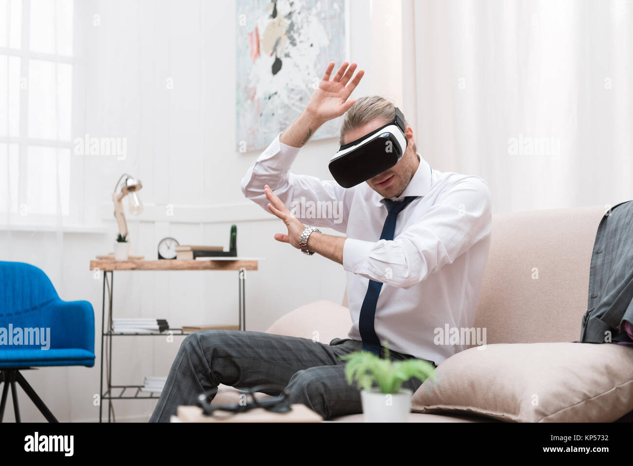 businessman gesturing and using Virtual reality headset Stock Photo - Alamy