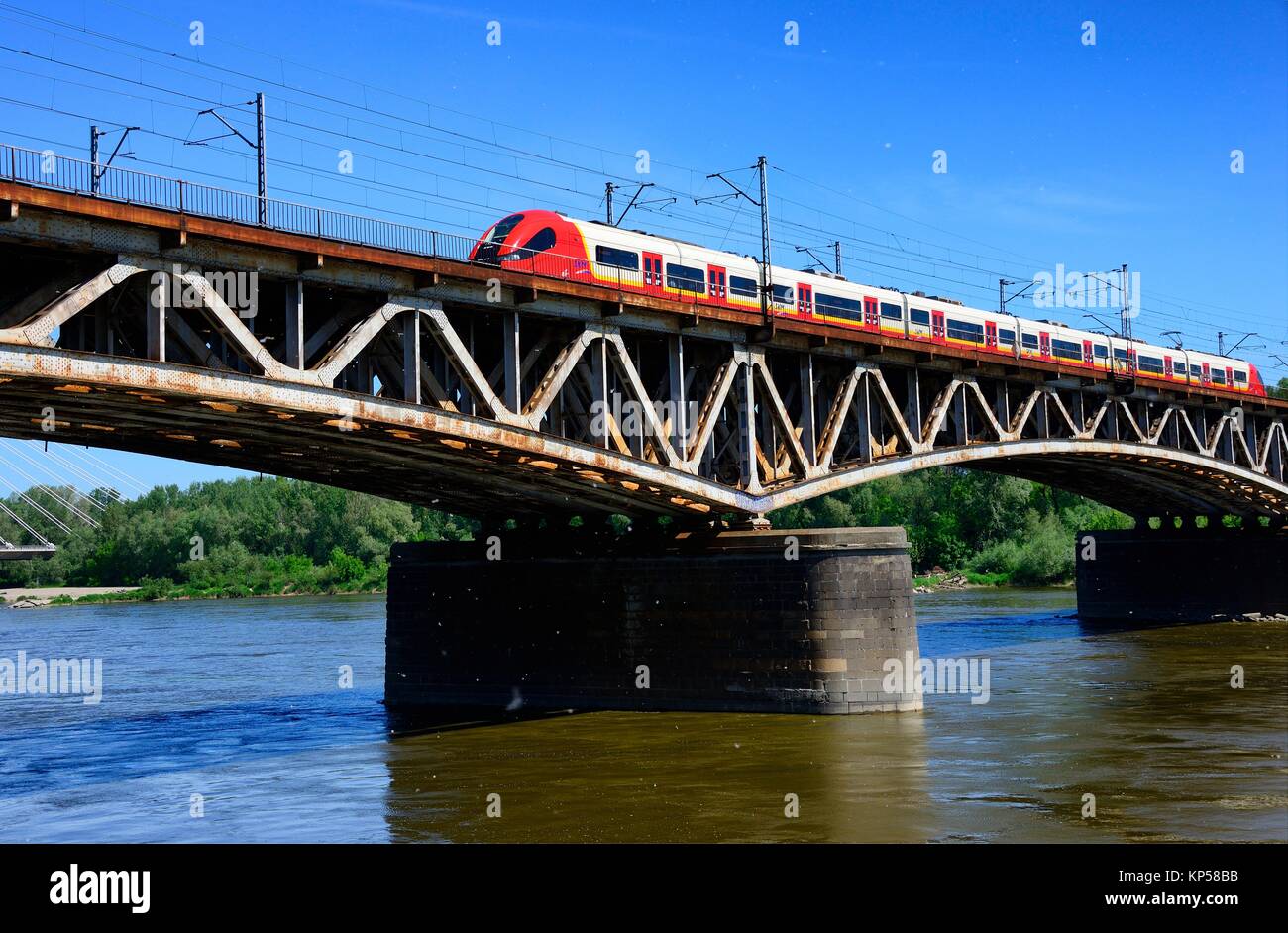 Srednicowy Bridge - rail bridge over the Vistula River in Warsaw, seen from western side of Vistula, May is the main period of dusting of oaks - here Stock Photo