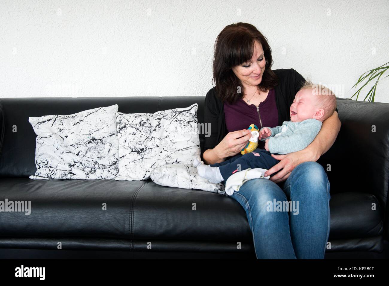 Zwijndrecht, Netherlands. Portrait of a young adult mother and her four