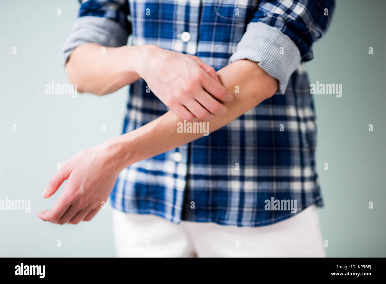Woman Itching Her Arm Stock Photo Alamy
