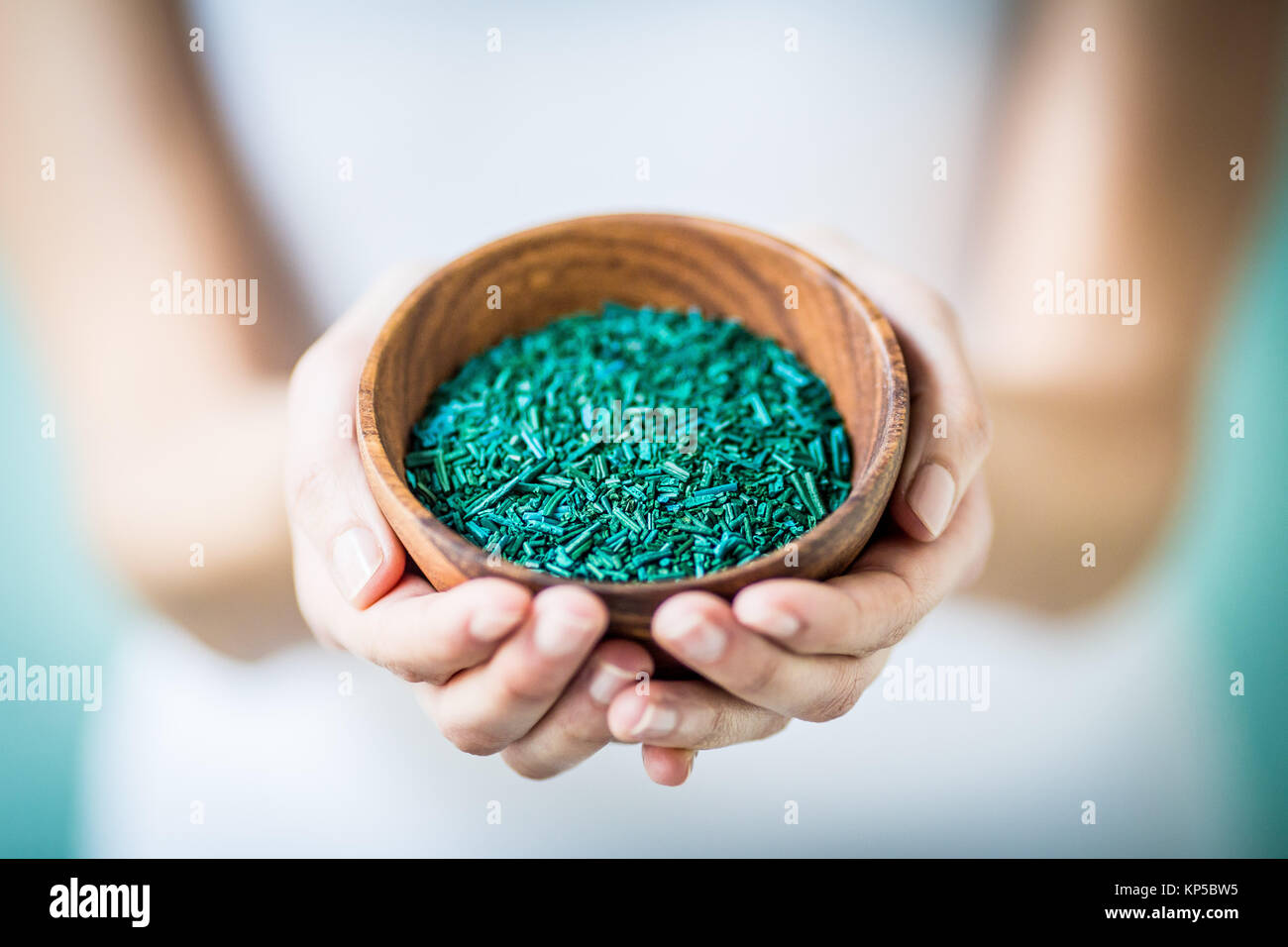 Woman taking food supplement of spirulina algae Stock Photo Alamy