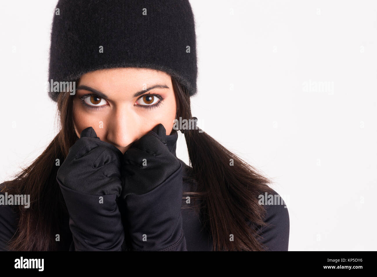 Pretty Woman Outlaw in Black Stealth Outfit Black Gloves Cap Stock Photo