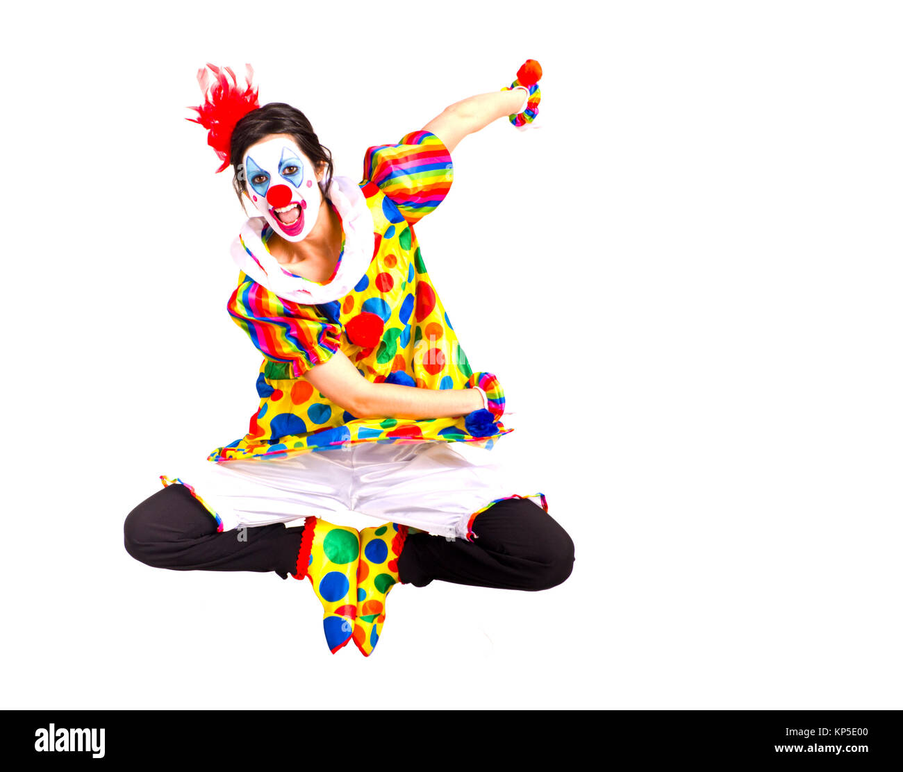 Color Clown Flies Jump Dancing into Air During Performance Stock Photo