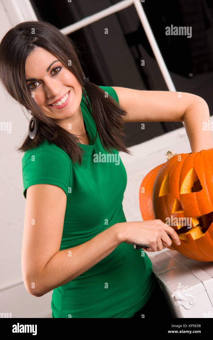 Attractive Nouse Mom Pumkin Carving Halloween Jack-O-Lantern Stock Photo