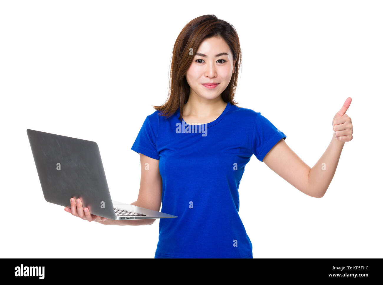 Young woman use of laptop and thumb up Stock Photo - Alamy