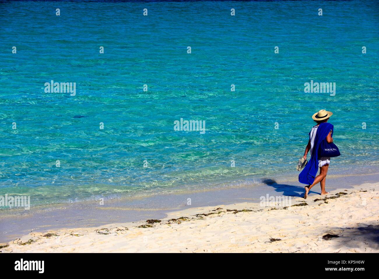 Woman walking on a beach of Cayo Santa Maria, Cuba. Stock Photo