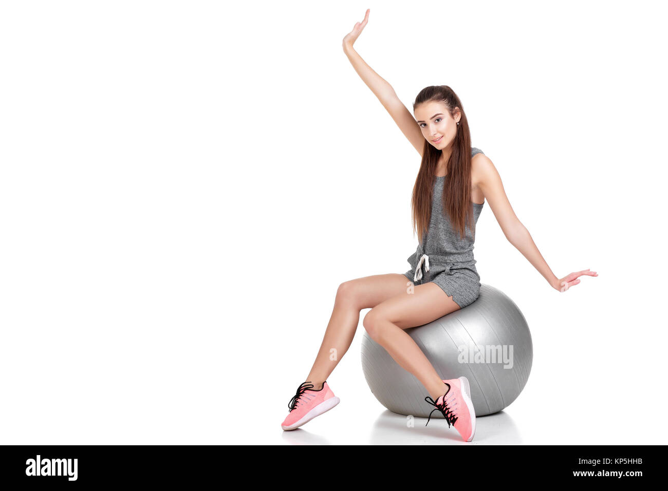 woman in sports clothes with fitness ball Stock Photo