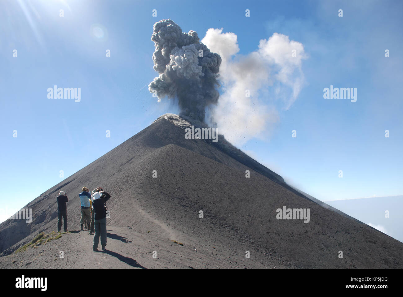trekkers view an eruption from the upper slopes of Fuego volcano in ...