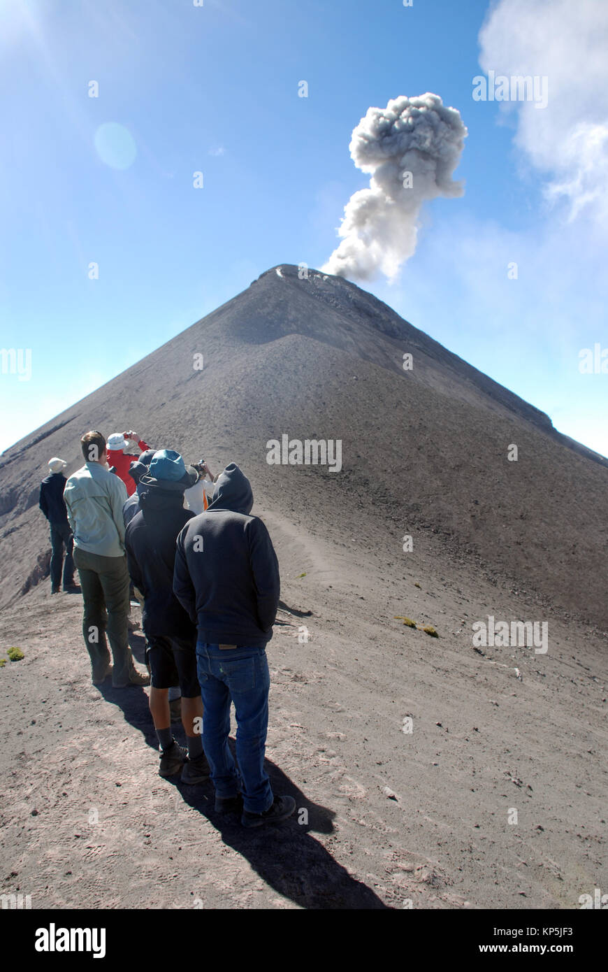 trekkers view an eruption from the upper slopes of Fuego volcano in ...