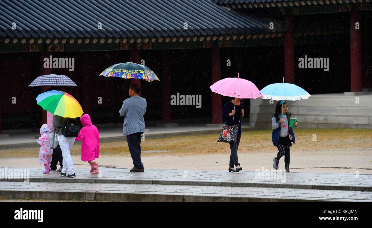 People under umbrella visit Changdeokgung Palace,Seoul,South Korea. Stock Photo