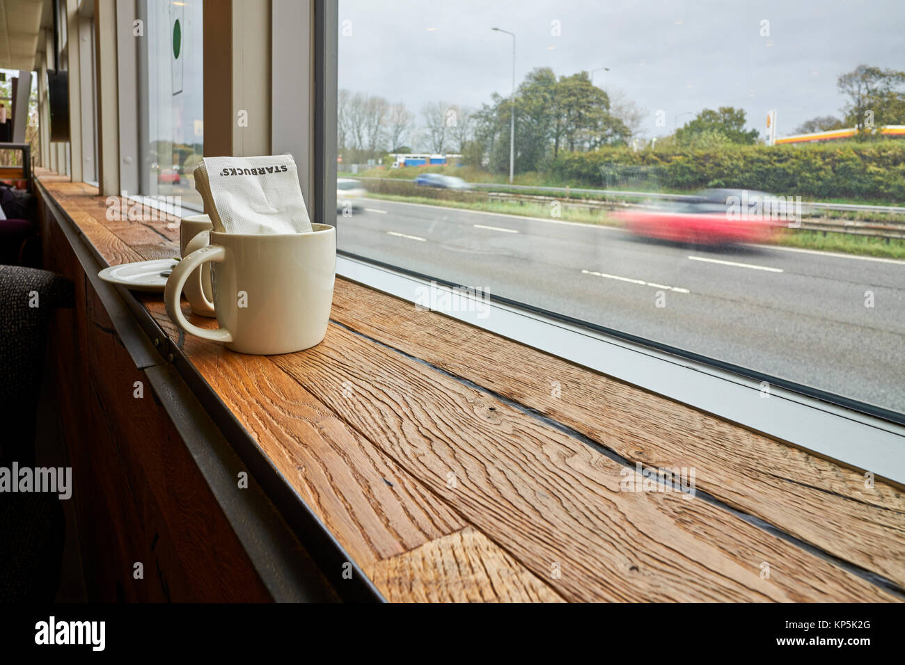 Starbucks coffee mug and serviette at M6 motorway service station Stock Photo