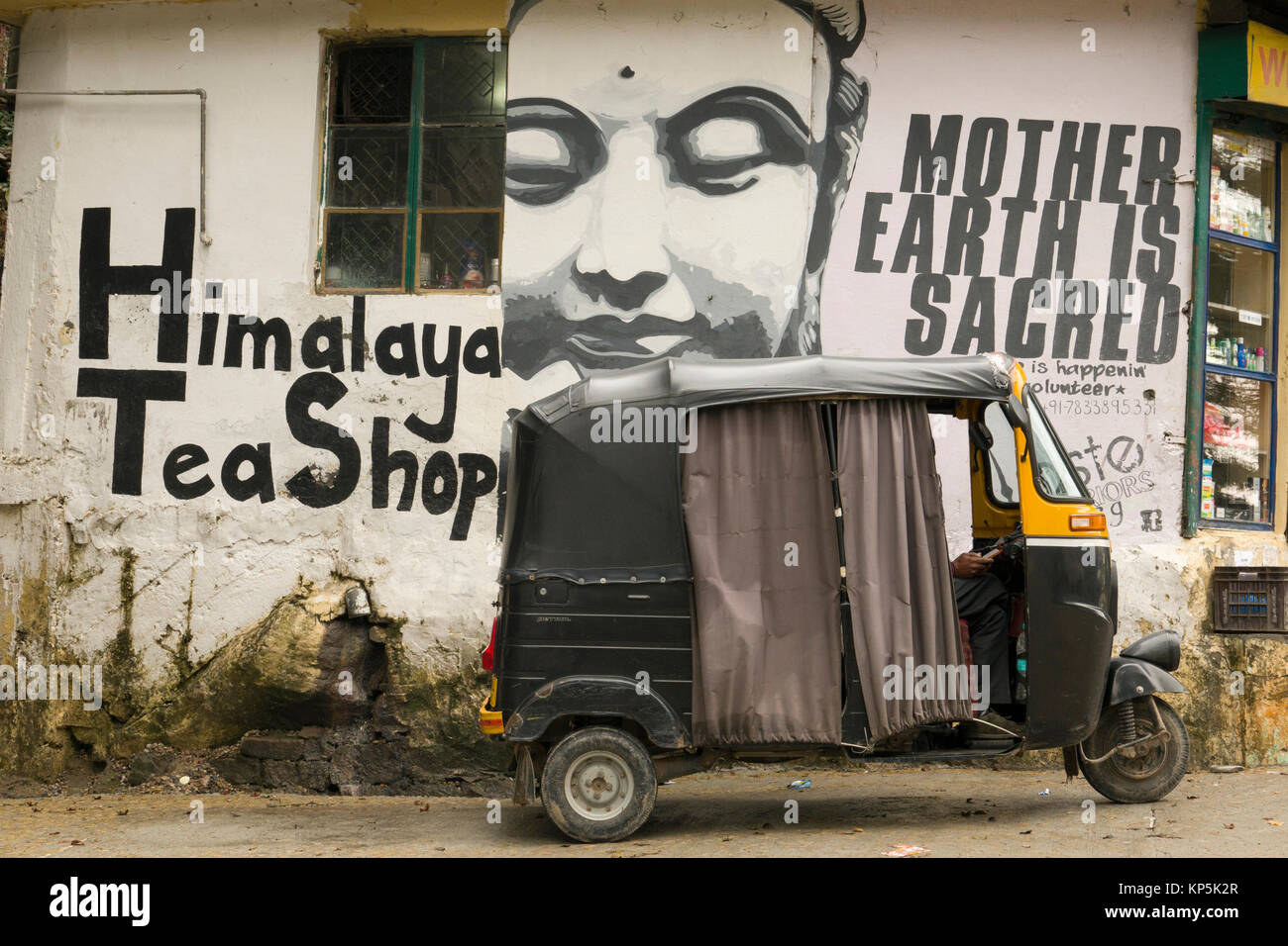 Auto rickshaw parked outside Himalaya tea shop in Dharamkot, India Stock Photo