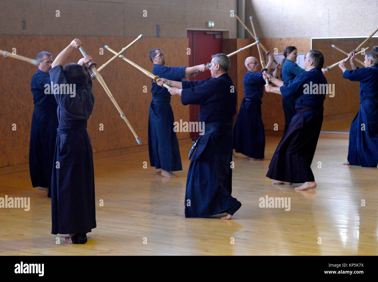 People holding real samurai swords during a swordsmanship exercise called kenjutsu or iaido martial arts demonstration,Sartrouville,Yvelines Stock Photo