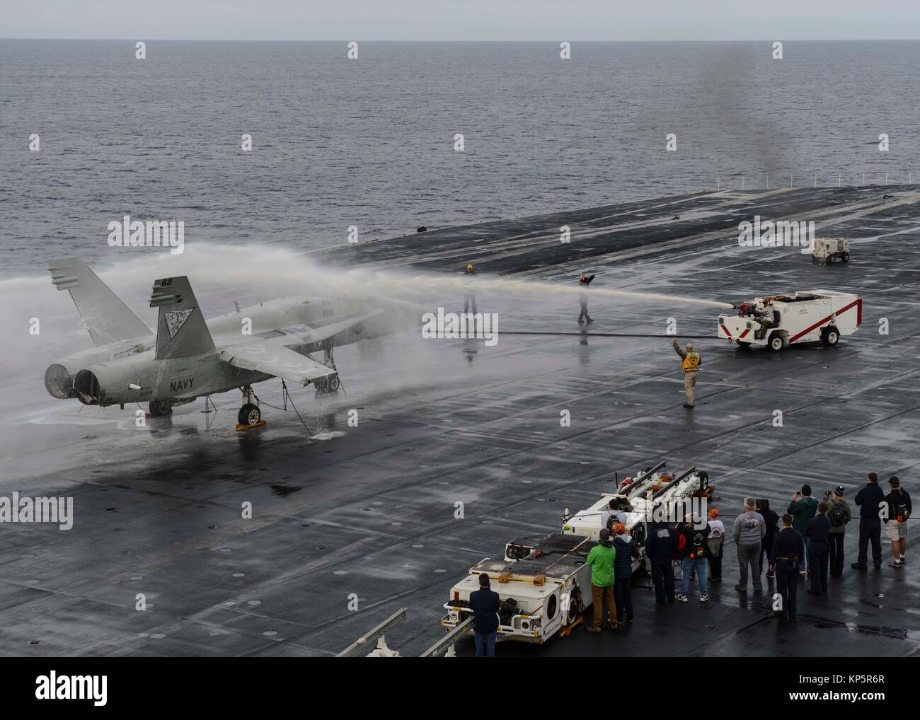 U.S. Navy sailors demonstrate an aircraft crash and salvage drill on the flight deck aboard the U.S. Navy Nimitz-class aircraft carrier USS Nimitz during Tiger Cruise December 8, 2017 in the Pacific Ocean.  (photo by Holly L. Herline via Planetpix) Stock Photo