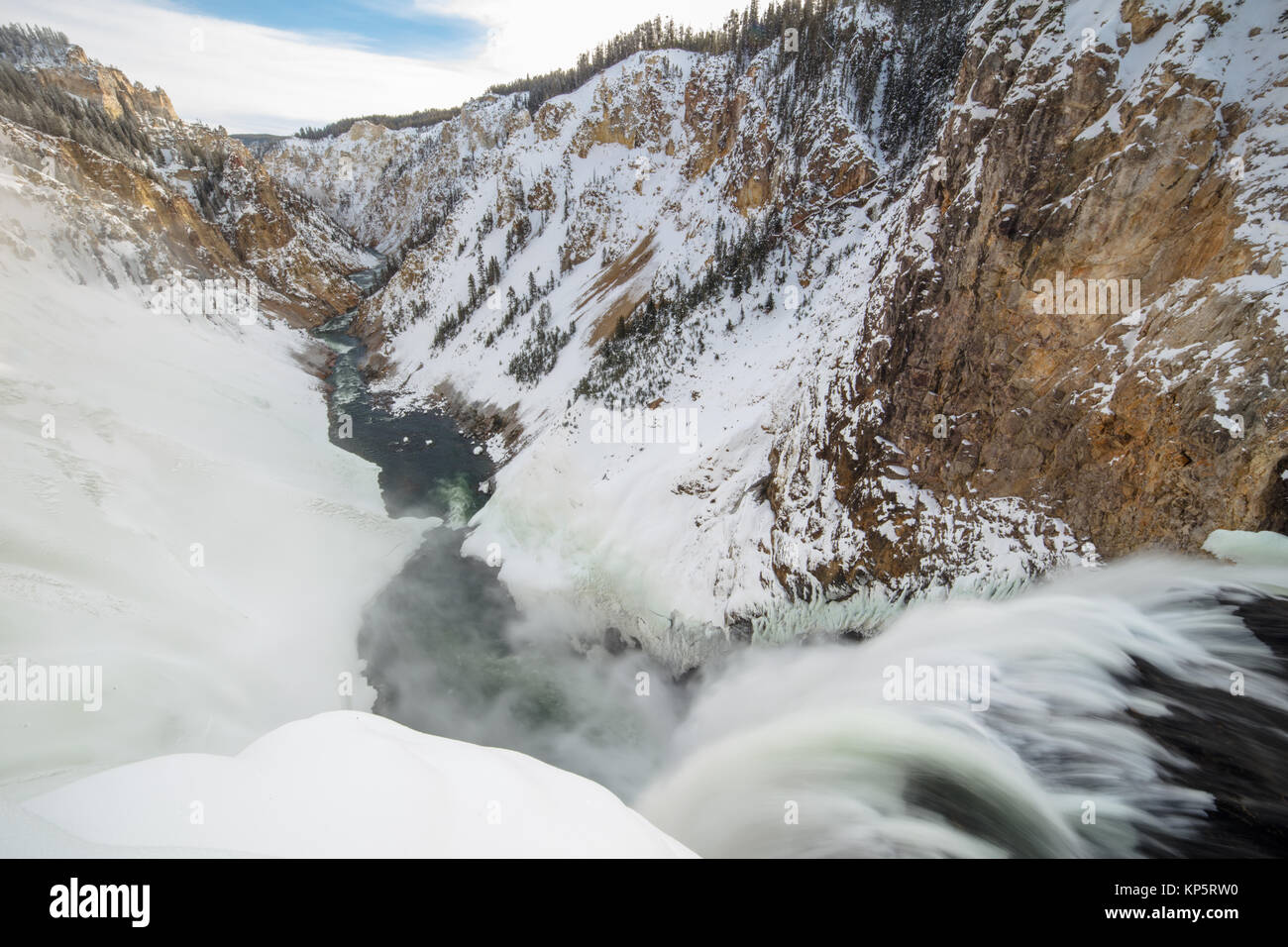 Snow covers the banks of the river at the Brink of the Lower Falls waterfall in the Yellowstone National Park Grand Canyon of the Yellowstone in winter November 15, 2017 in Wyoming.  (photo by Jacob W. Frank via Planetpix) Stock Photo