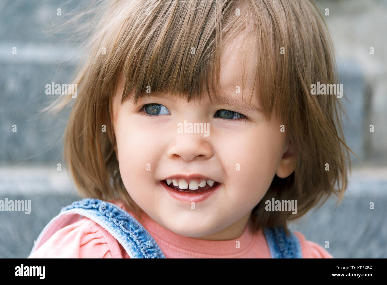 Cute Caucasian girl with short hair in summer Stock Photo - Alamy
