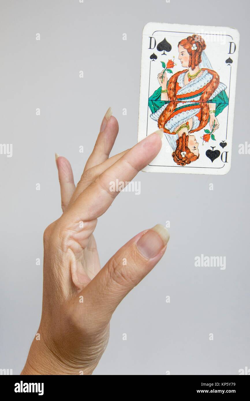 Hand holding a playing card Stock Photo Alamy
