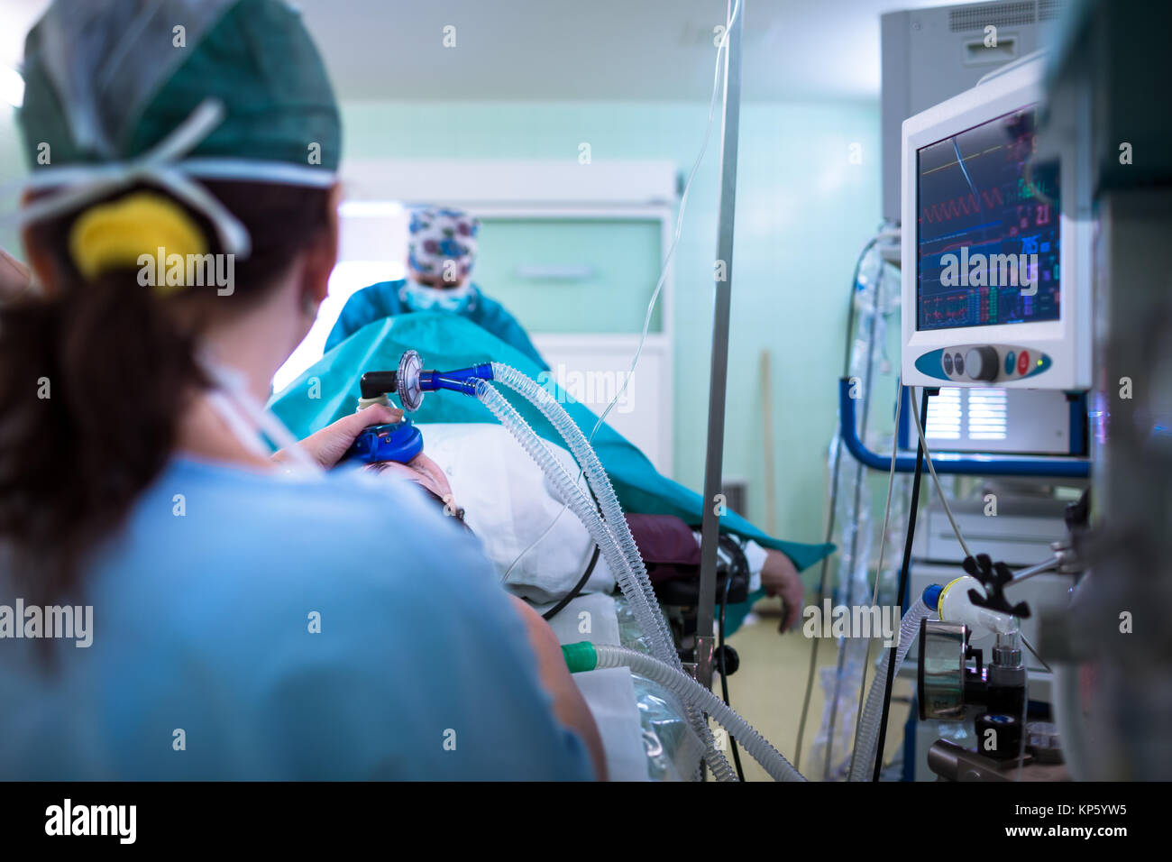 Anesthesia patient under narcosis, breathing through a mask during surgery Stock Photo Alamy