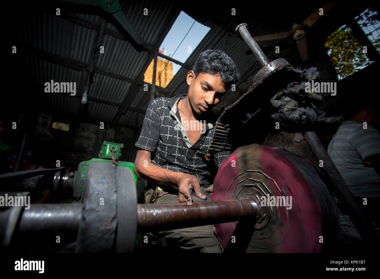 Ashiq Age 20 is working at a small factory near of Burigonga River at ...