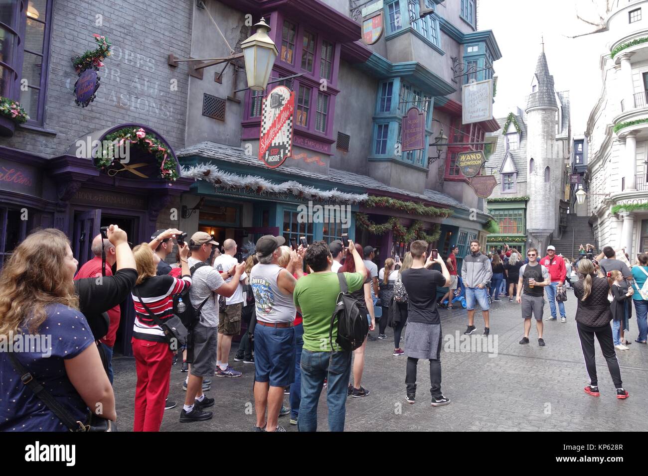 A crowd of tourists taking pictures in Diagon Alley in the Wizarding World of Harry Potter, at Universal Studios in Orlando, Florida, USA. Stock Photo