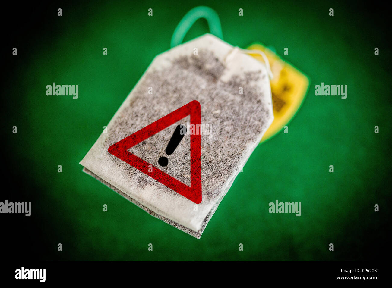 Warning pictogram on a tea bag. Conceptual image of the many pesticides found in tea. Stock Photo