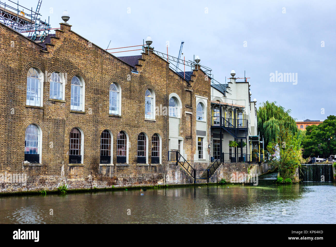 View of Apartments in converted warehouses on Regent's Canal, Camden Town ...