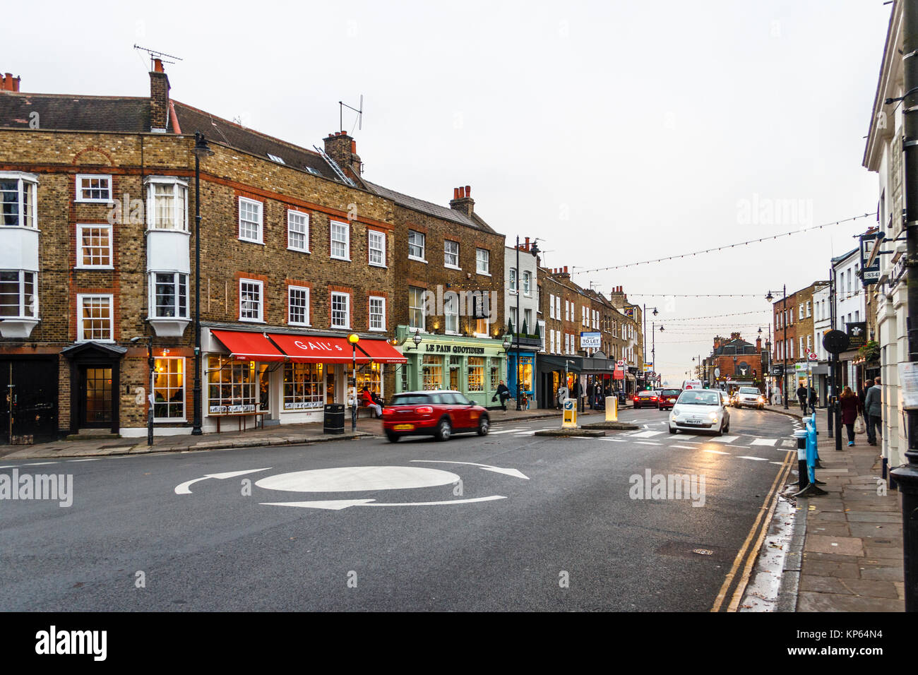 The high street in Highgate Village, London, UK, on a December evening Stock Photo