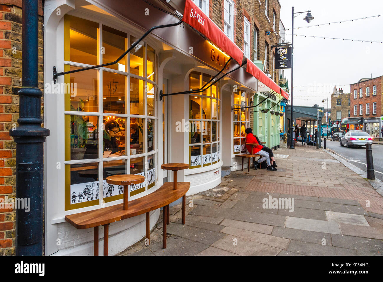 The high street in Highgate Village, London, UK, on a December evening Stock Photo