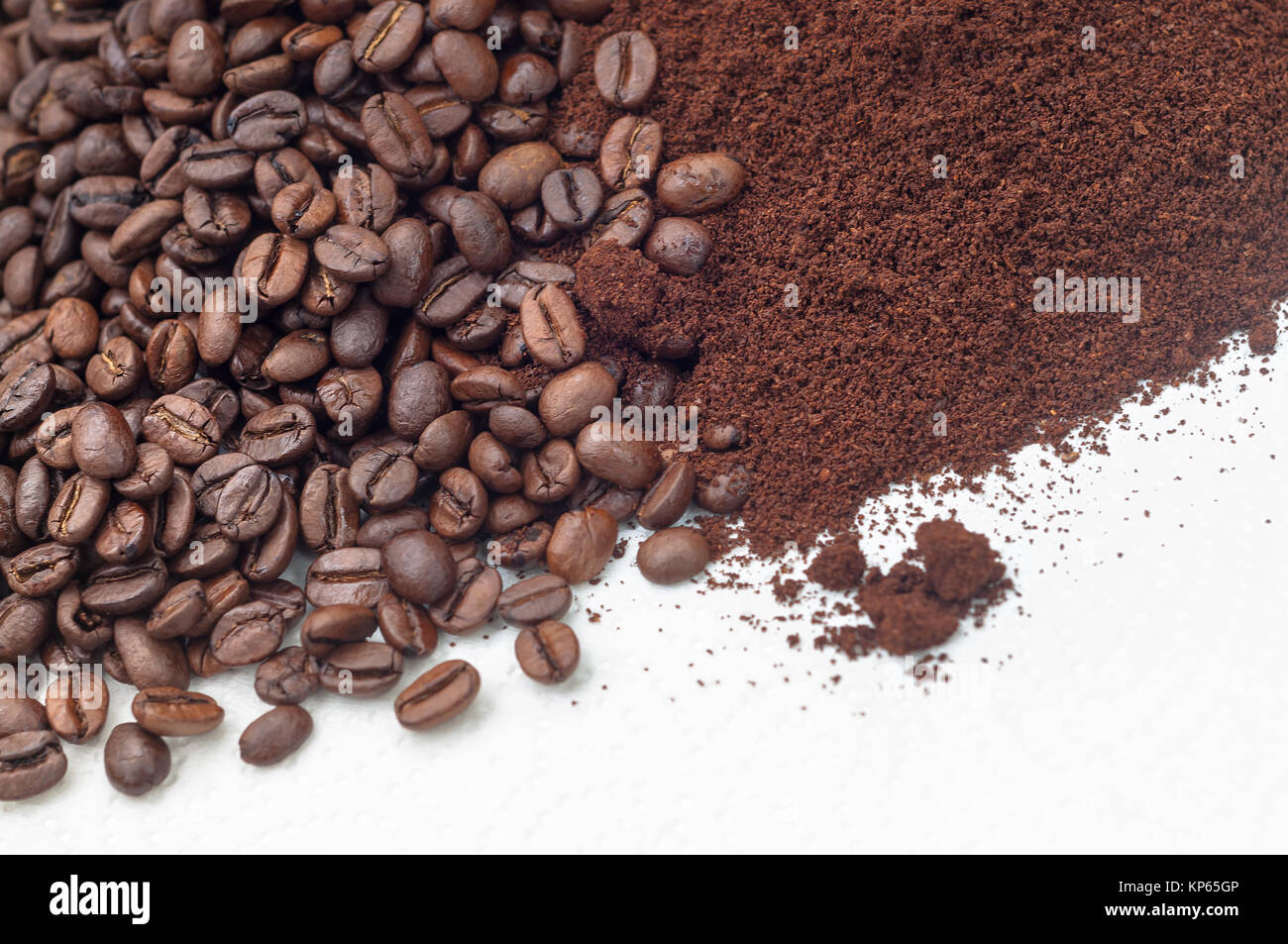 coffee beans and ground coffee on a white background,decorative and striking,space for text,extendable down Stock Photo