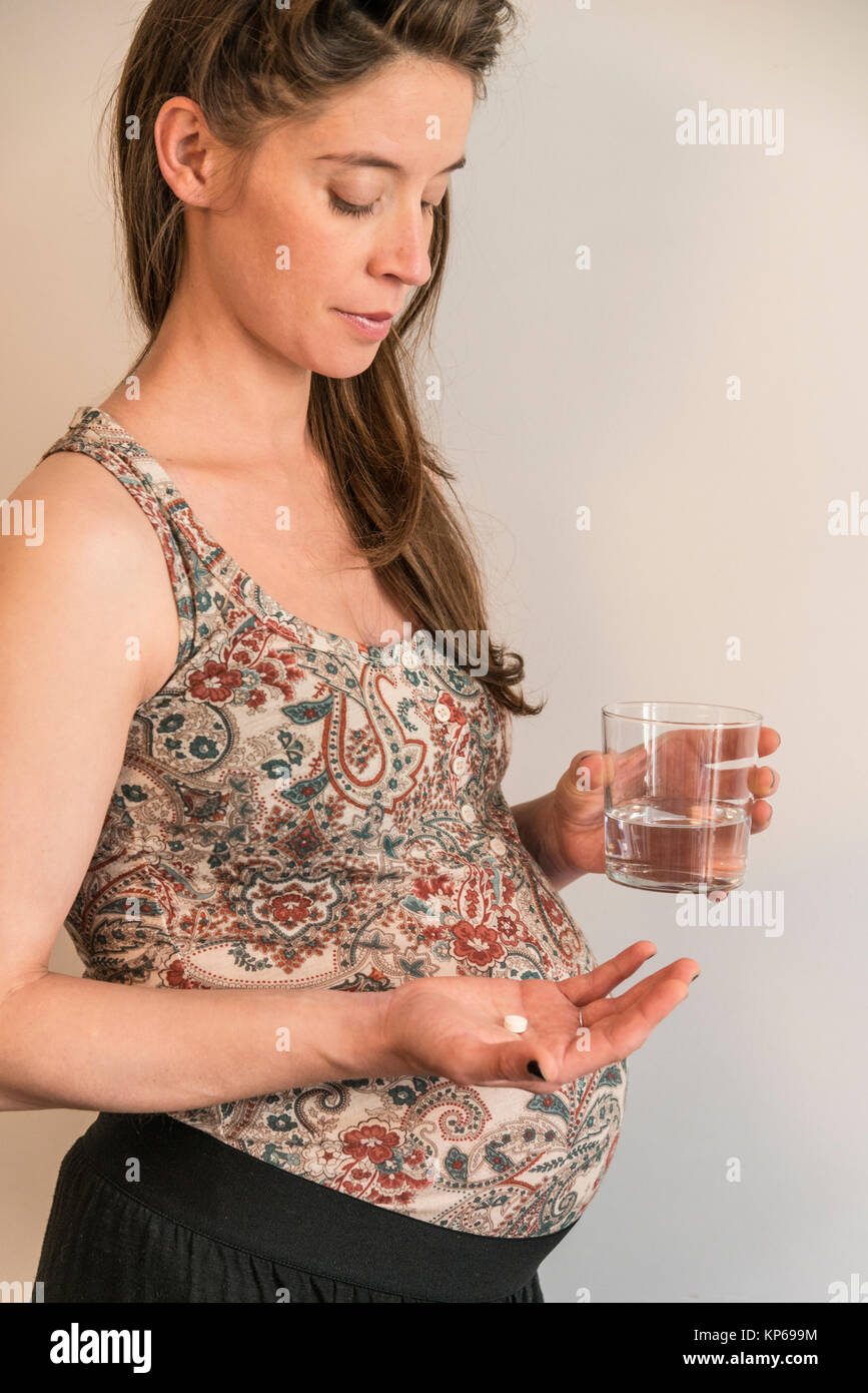 PREGNANT WOMAN TAKING MEDICATION Stock Photo Alamy