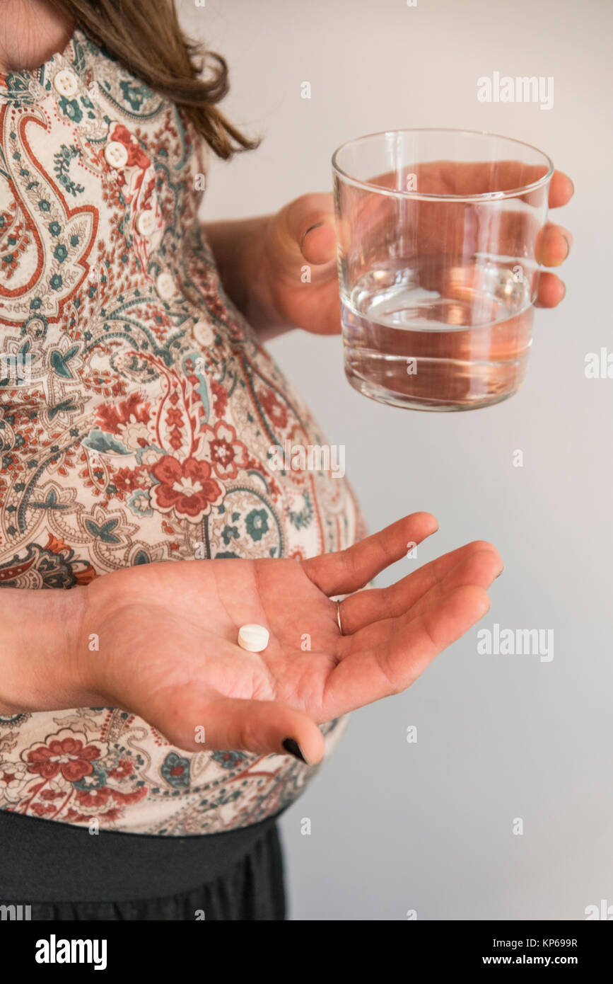 PREGNANT WOMAN TAKING MEDICATION Stock Photo Alamy