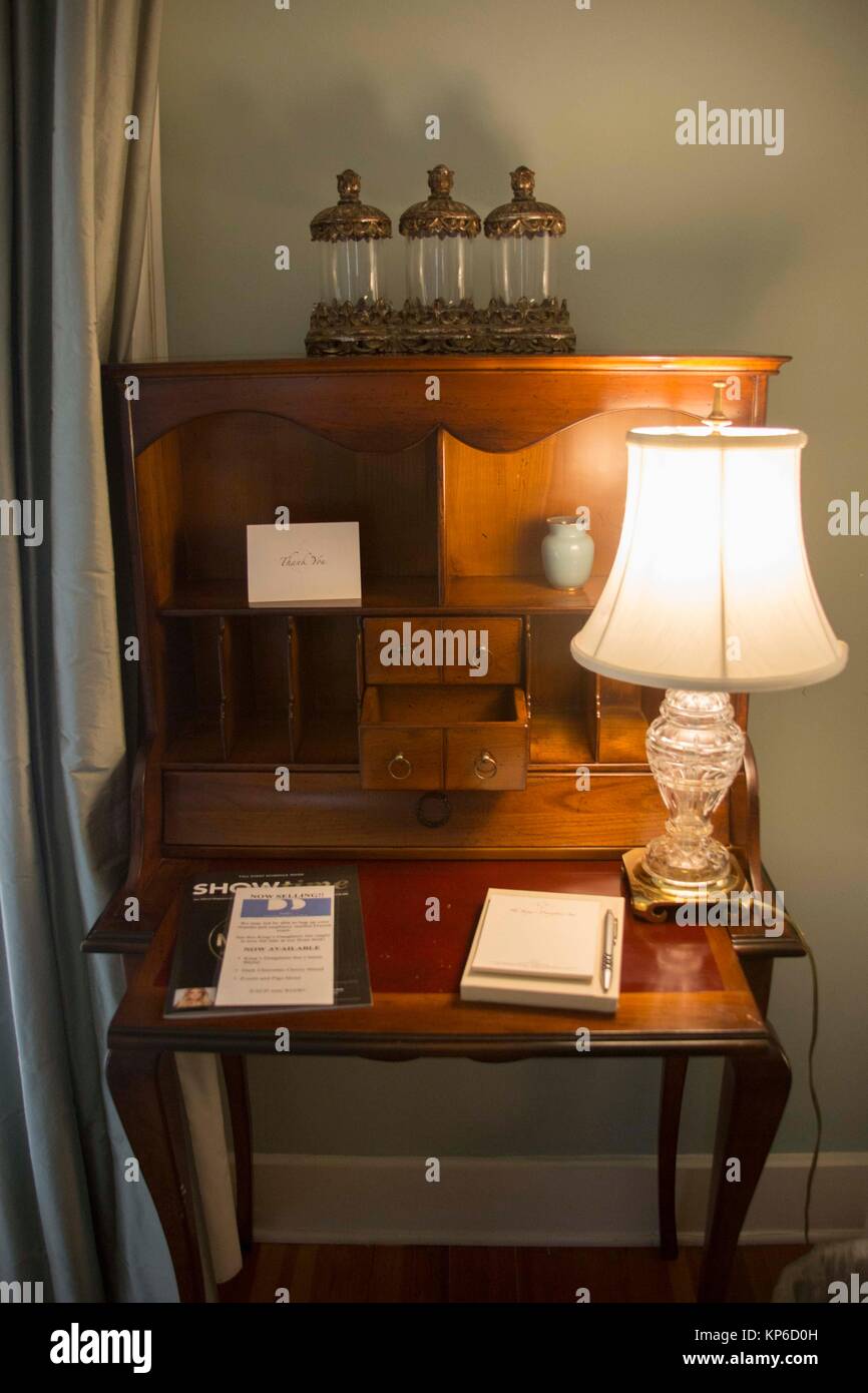 Beautiful designed old fashioned bureau, old fashion writing desk with a  lamp on the top Stock Photo - Alamy