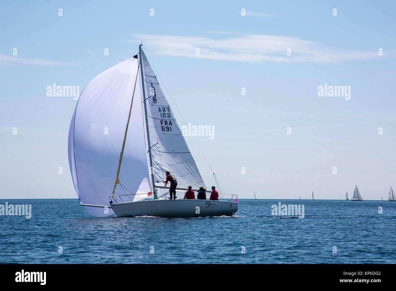 Sail boat with full sail and full wind passing by in the French ocean