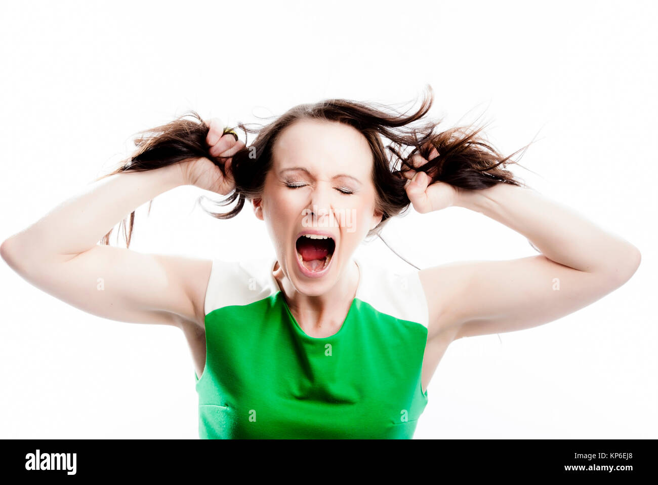 Frau zieht an ihren Haaren - woman with brown hair Stock Photo