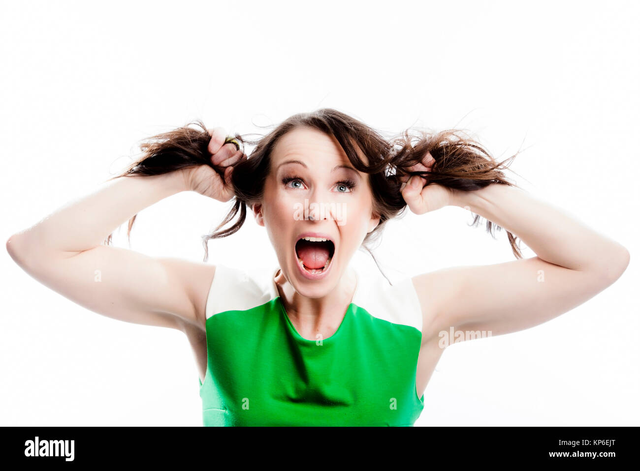 Frau zieht an ihren Haaren - woman with brown hair Stock Photo