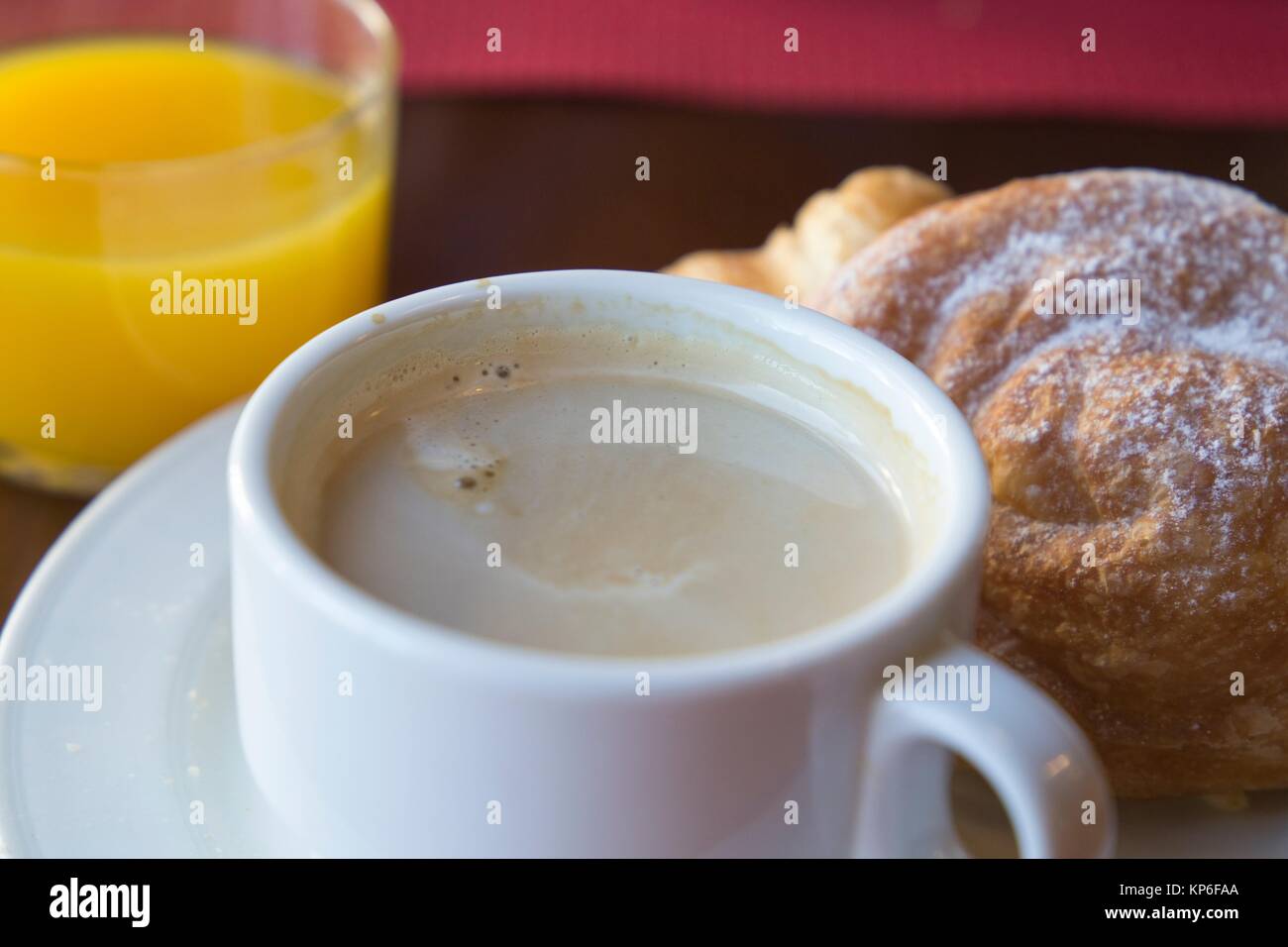 Breakfast on table coffee with pastries and orange juice Stock Photo