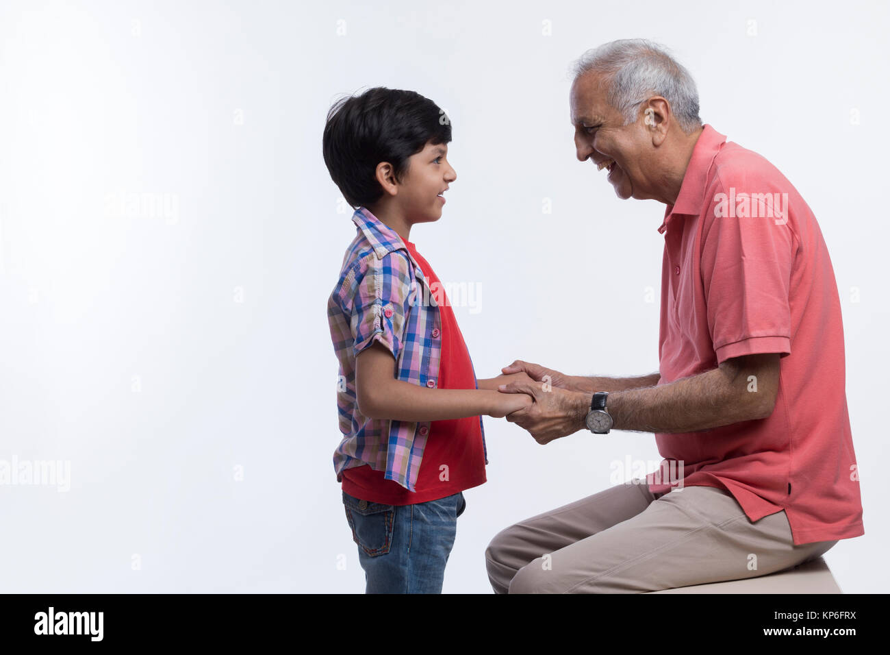 Grandfather holding hands of grandson Stock Photo - Alamy