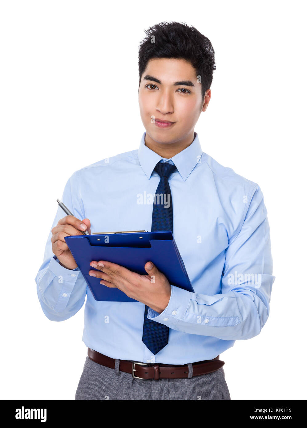 Asian businessman take note on clipboard Stock Photo - Alamy