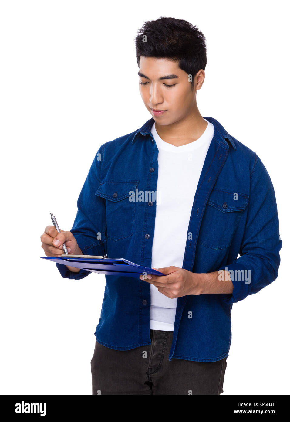 Man take note on clipboard Stock Photo - Alamy